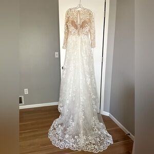 Beautiful lace top Abella wedding dress with shear lace sleeves and back button